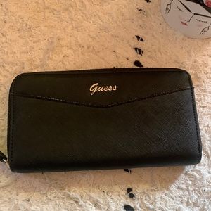 Silver and black Guess wallet.